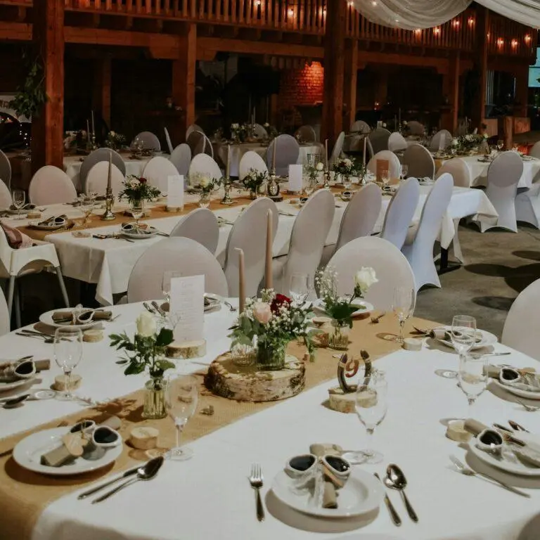 Banquet hall with round tables set for a wedding reception